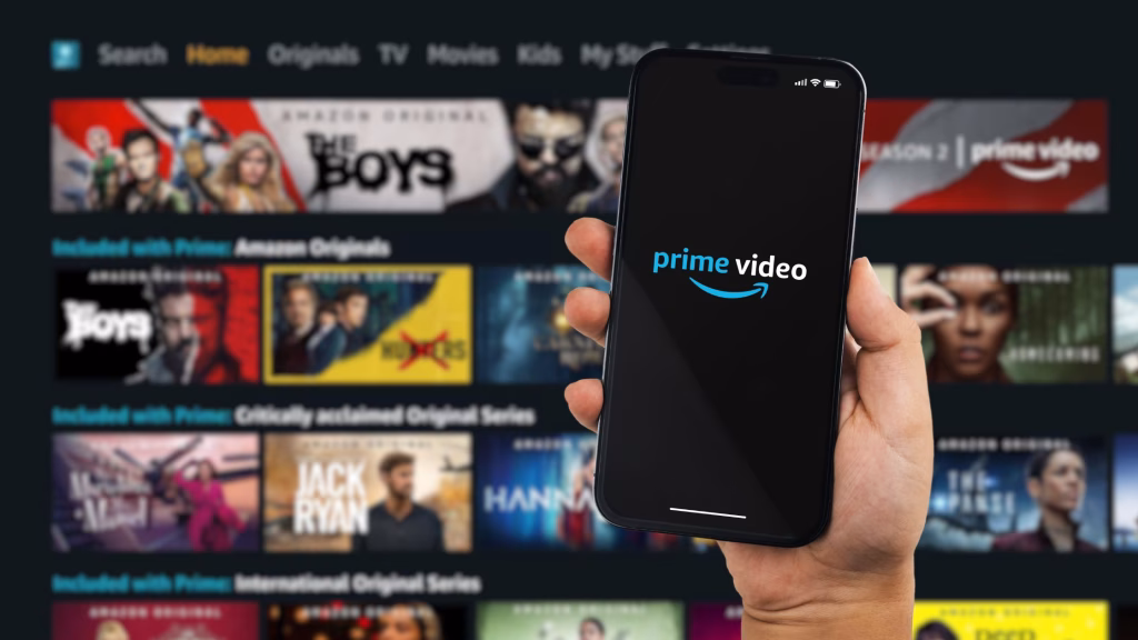 Boy holding a smartphone iPhone 14 Pro with Amazon Prime Video streaming app app on the screen. Website blurred in the background. Rio de Janeiro, RJ, Brazil. October 2022. (Diego Thomazini/Shutterstock)