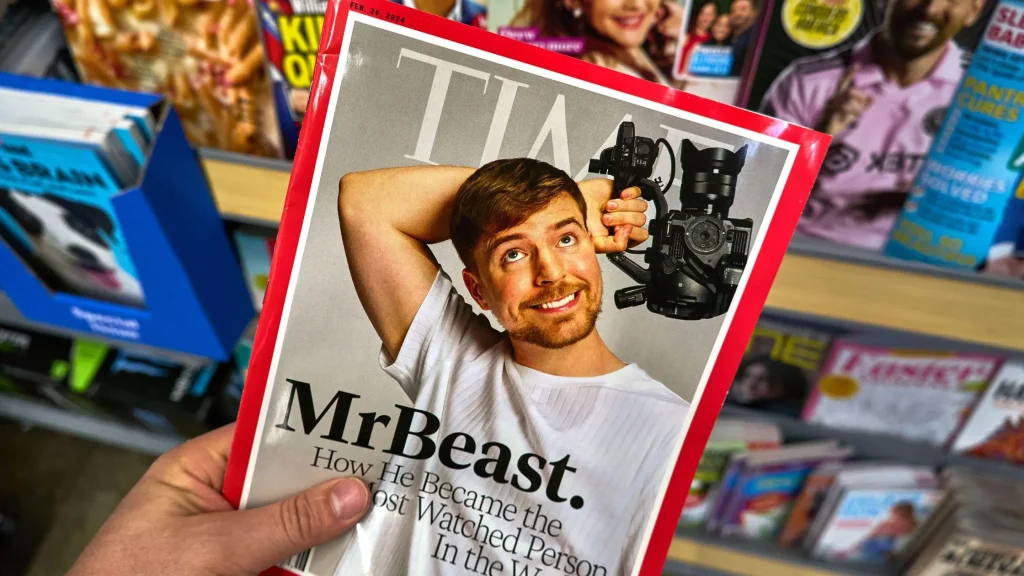 Dallas, TX USA - February 24, 2024: A hand holding Time magazine with James Stephen MrBeast on cover. MrBeast, a YouTube star known for his high-energy challenges is an American YouTuber (dennizn / Alamy Stock Photo)